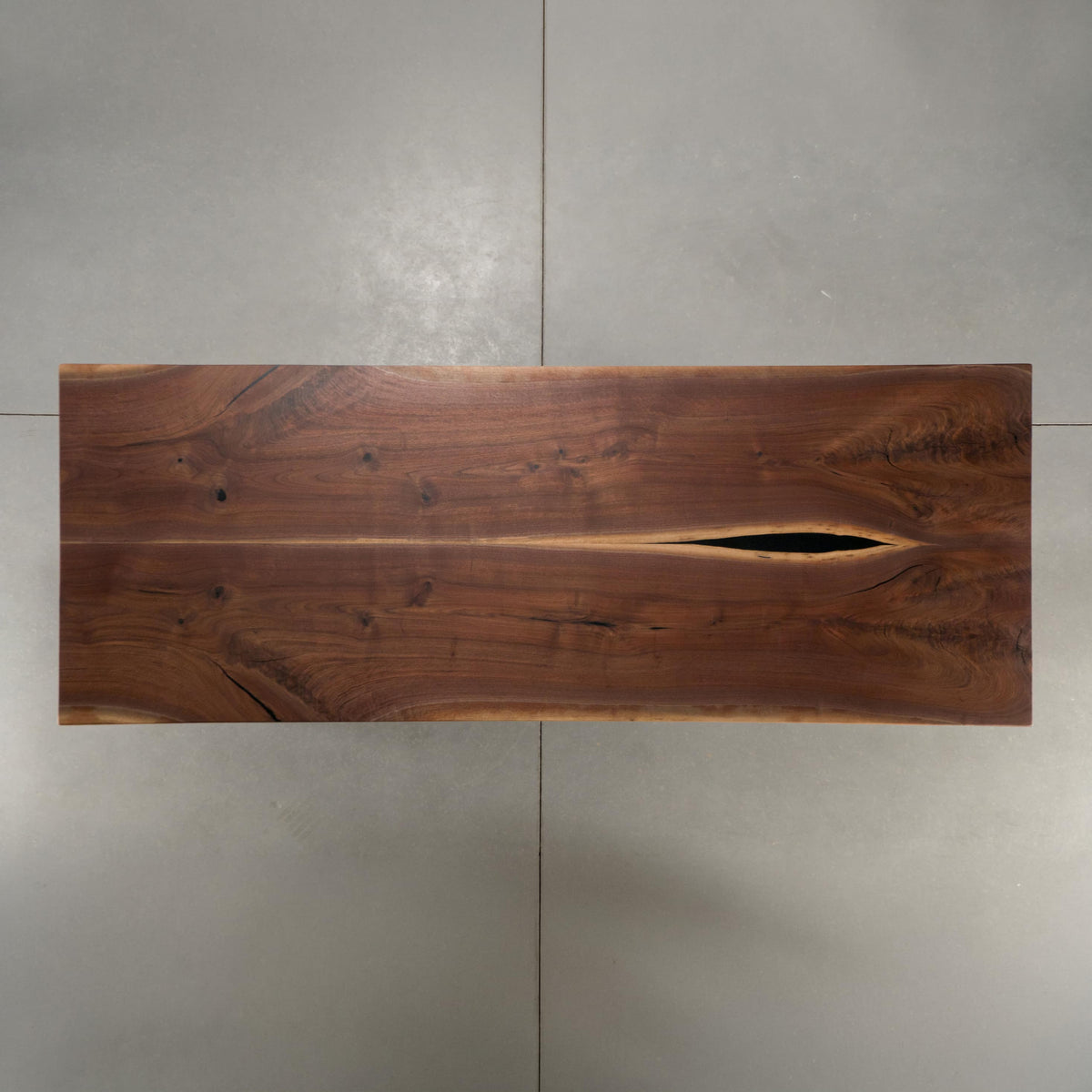 symmetry of a bookmatch Walnut table 40” wide x 108” long, finished in Pure D 