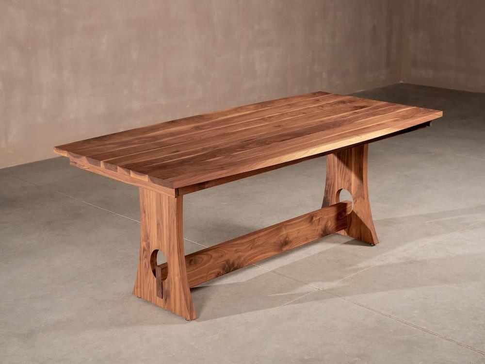 walnut table on a custom trestle base
