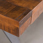 corner detail of a rustic maple trestle table finished in cinnamon; 42