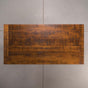 top view of a rustic maple trestle table finished in cinnamon; 42