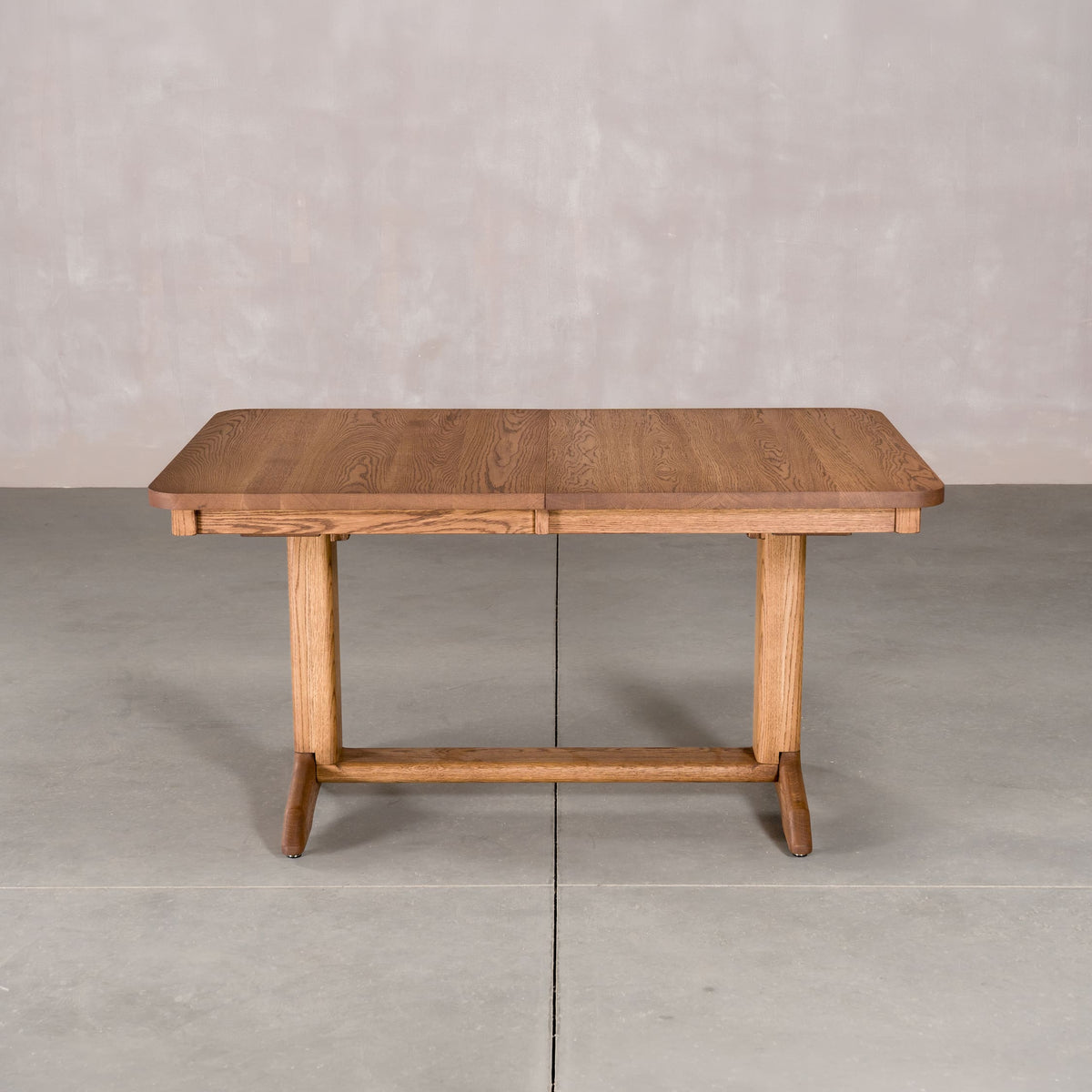 rectangle extendable Oak table 36 wide x 57” long, finished in Cortado D on Tobin base