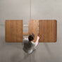 overhead shot of adding a leaf to an Oak extendable table finished in Cortado D