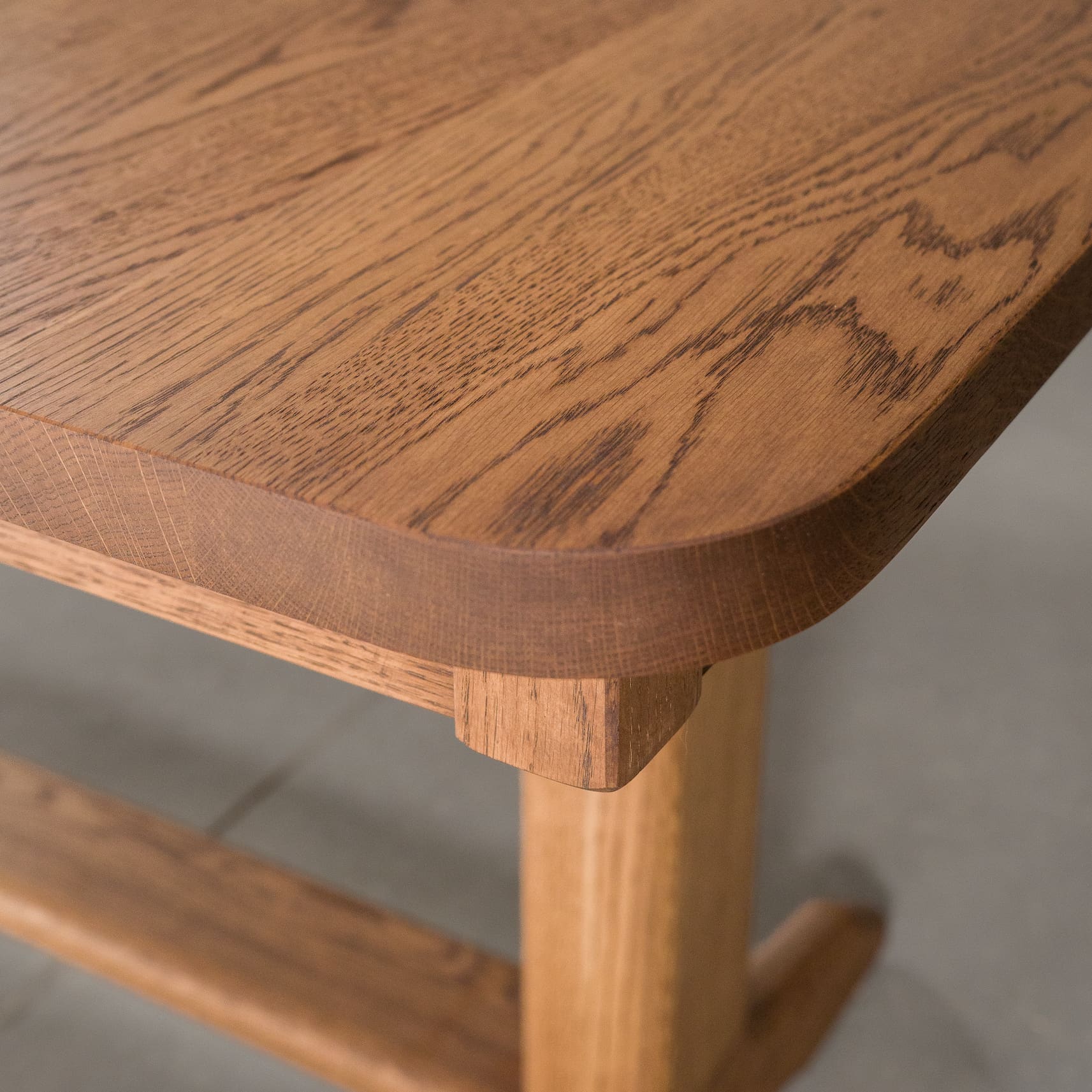 detail of Boyer edge on rectangle extendable Oak table finished in Cortado D 