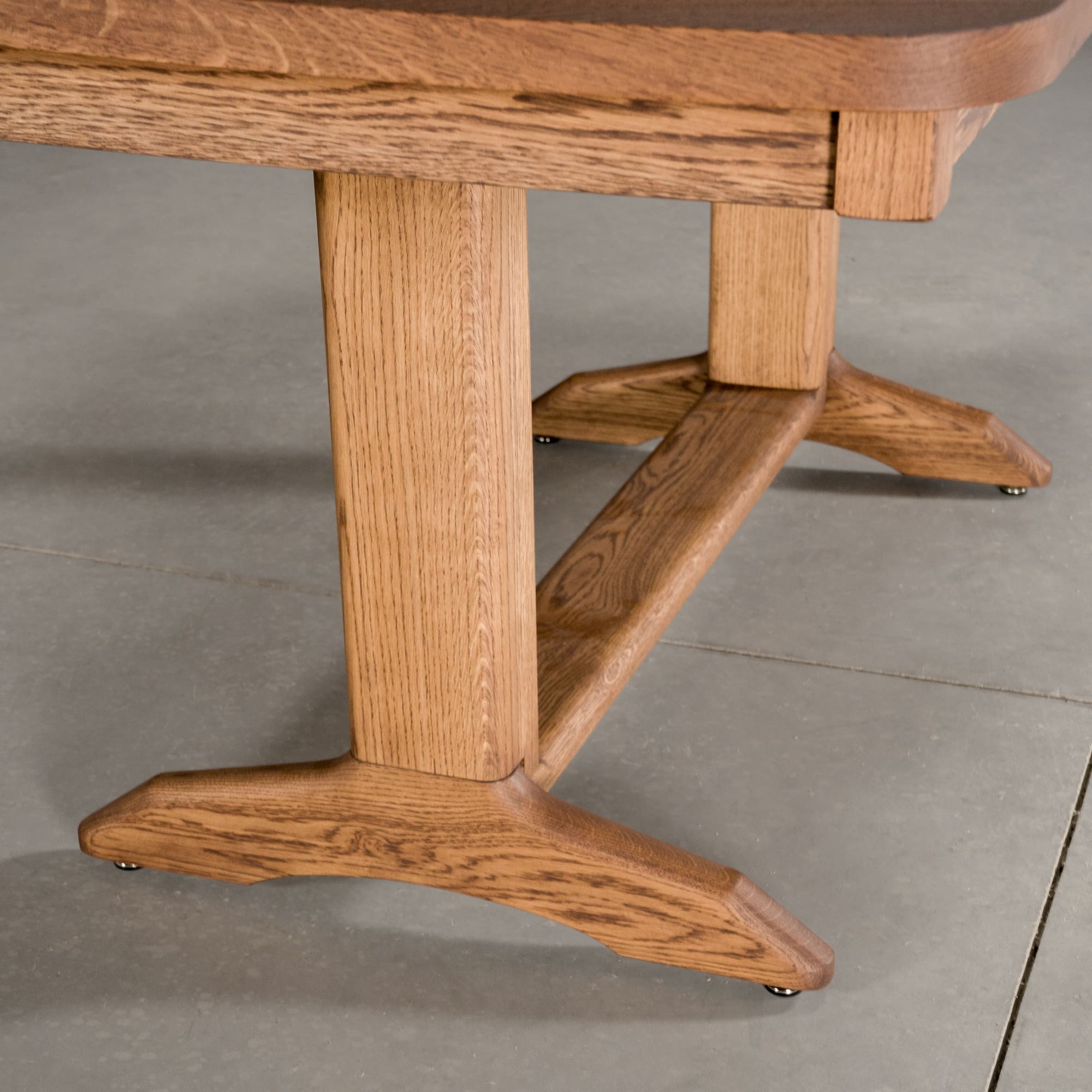 the shape of a Tobin base on an extendable Oak table finished in Cortado D 