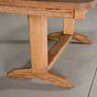 the shape of a Tobin base on an extendable Oak table finished in Cortado D 