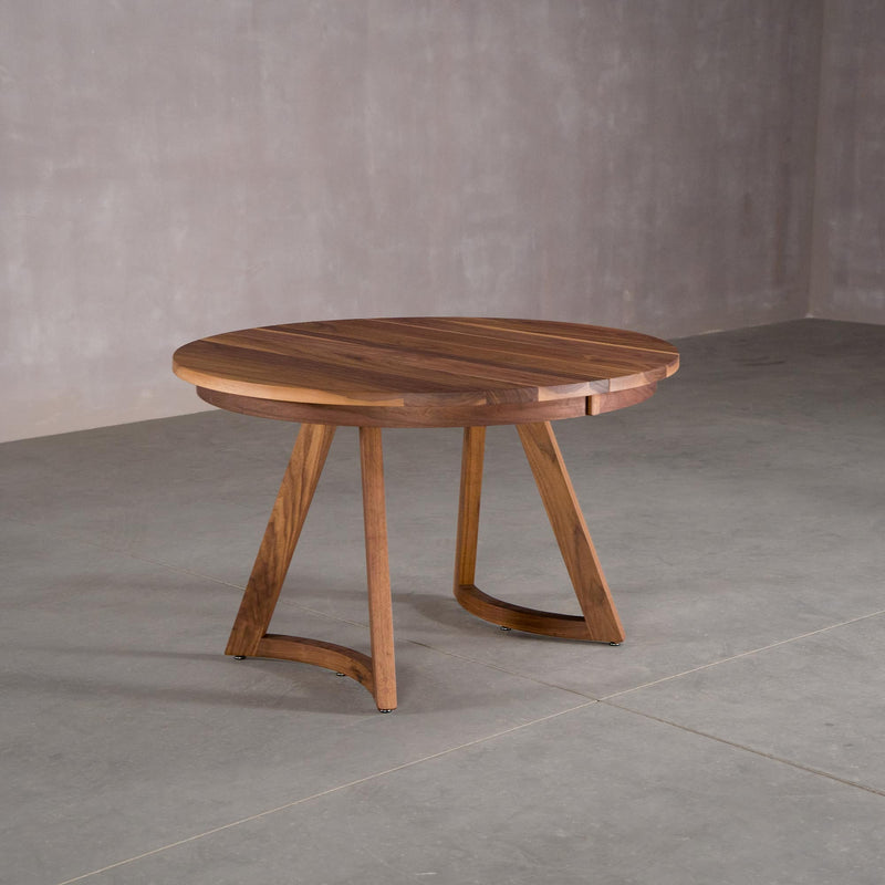 round extendable Walnut table 48” wide x 48” long, finished in Pure D on Chesbro legs