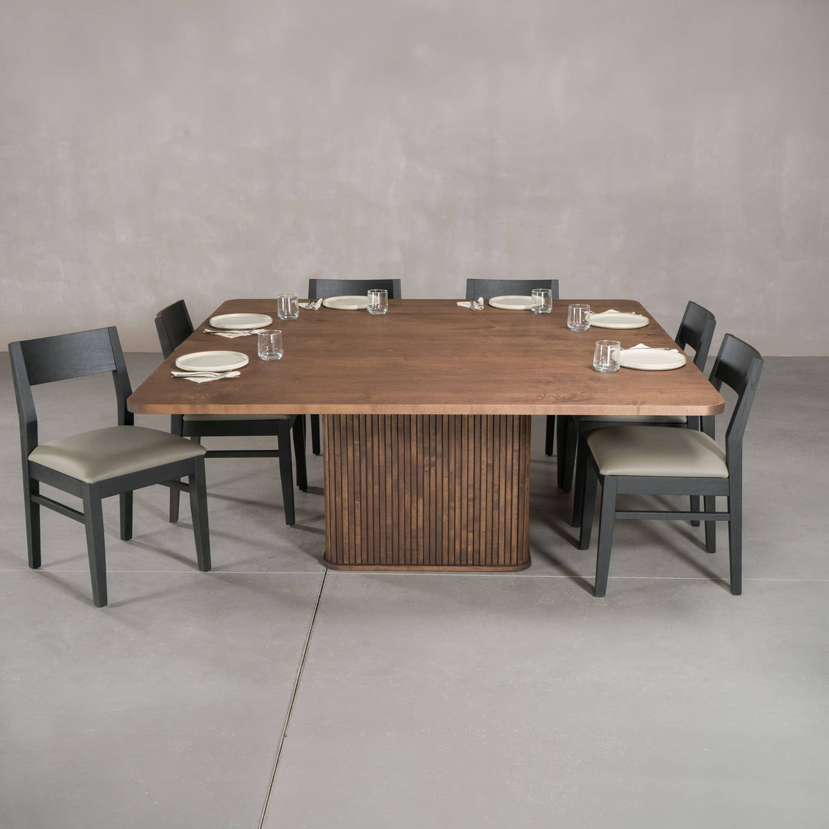 square Maple pedestal table 72” wide x 72” long, shown with Aubrey dining chairs and place settings