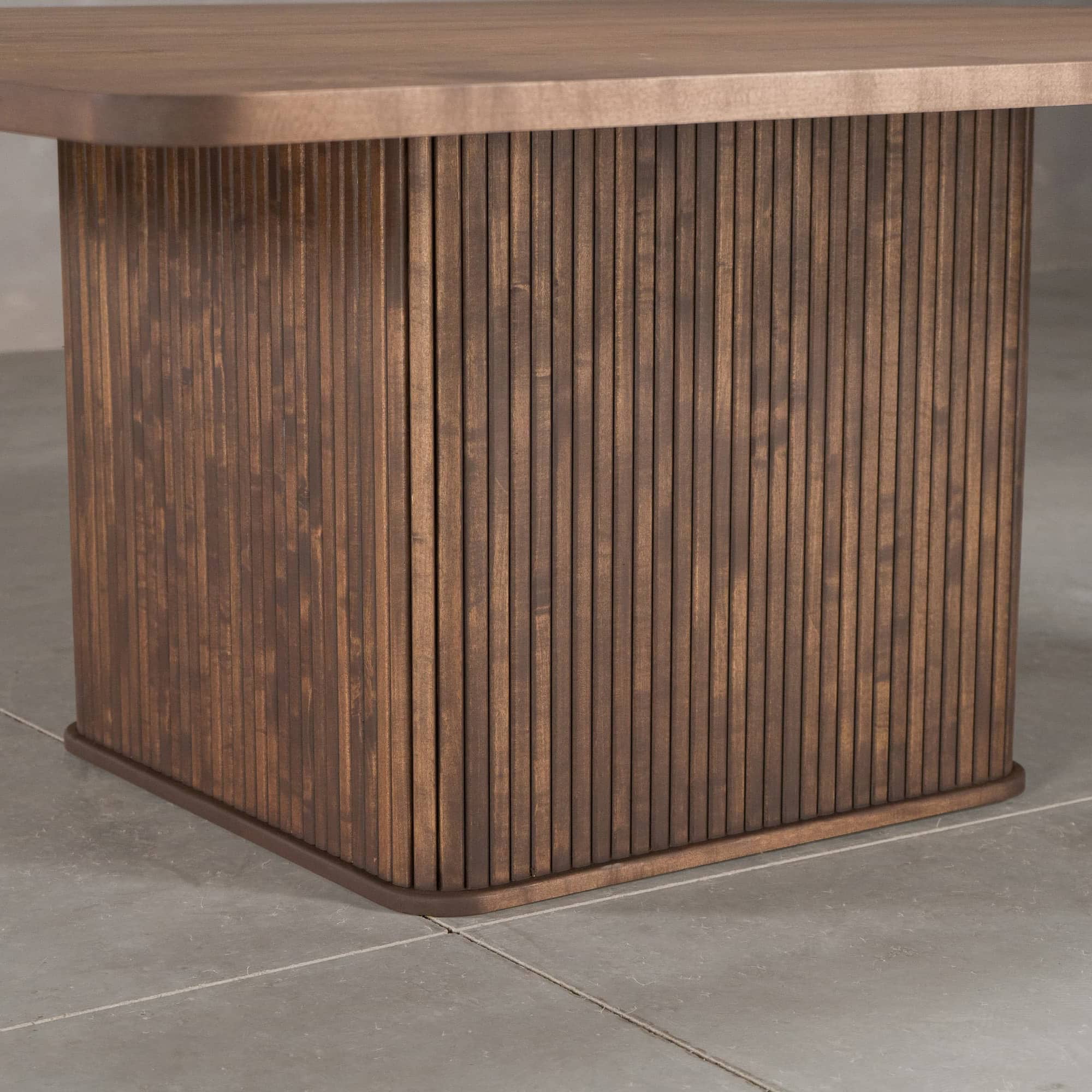 square Como pedestal base finished in Maple under a square table