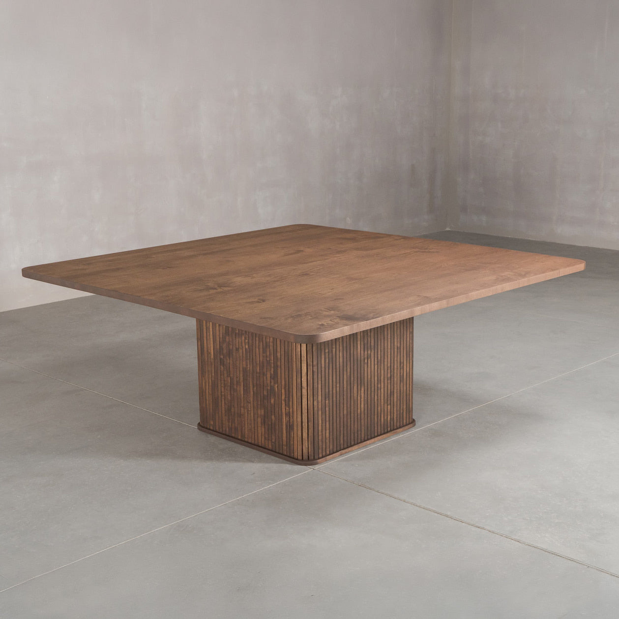 square Maple table 72” wide x 72” long, finished in Cortado W on Como pedestal