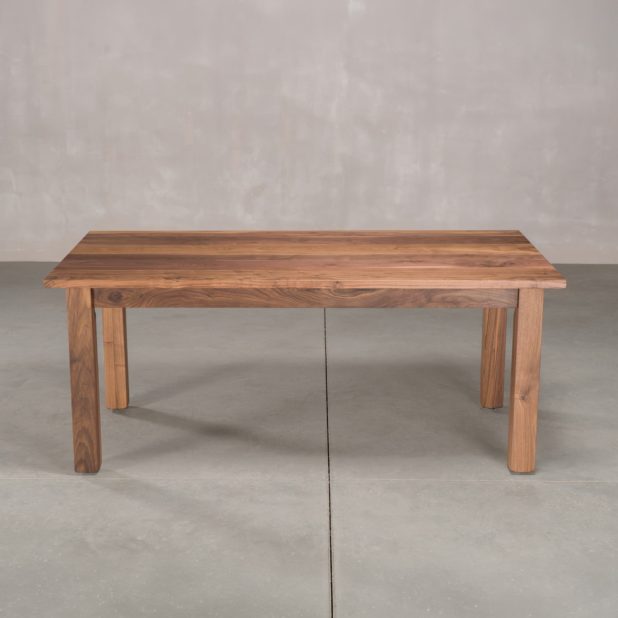 rectangle Walnut table 36” wide x 72” long, finished in Pure D on Parker base