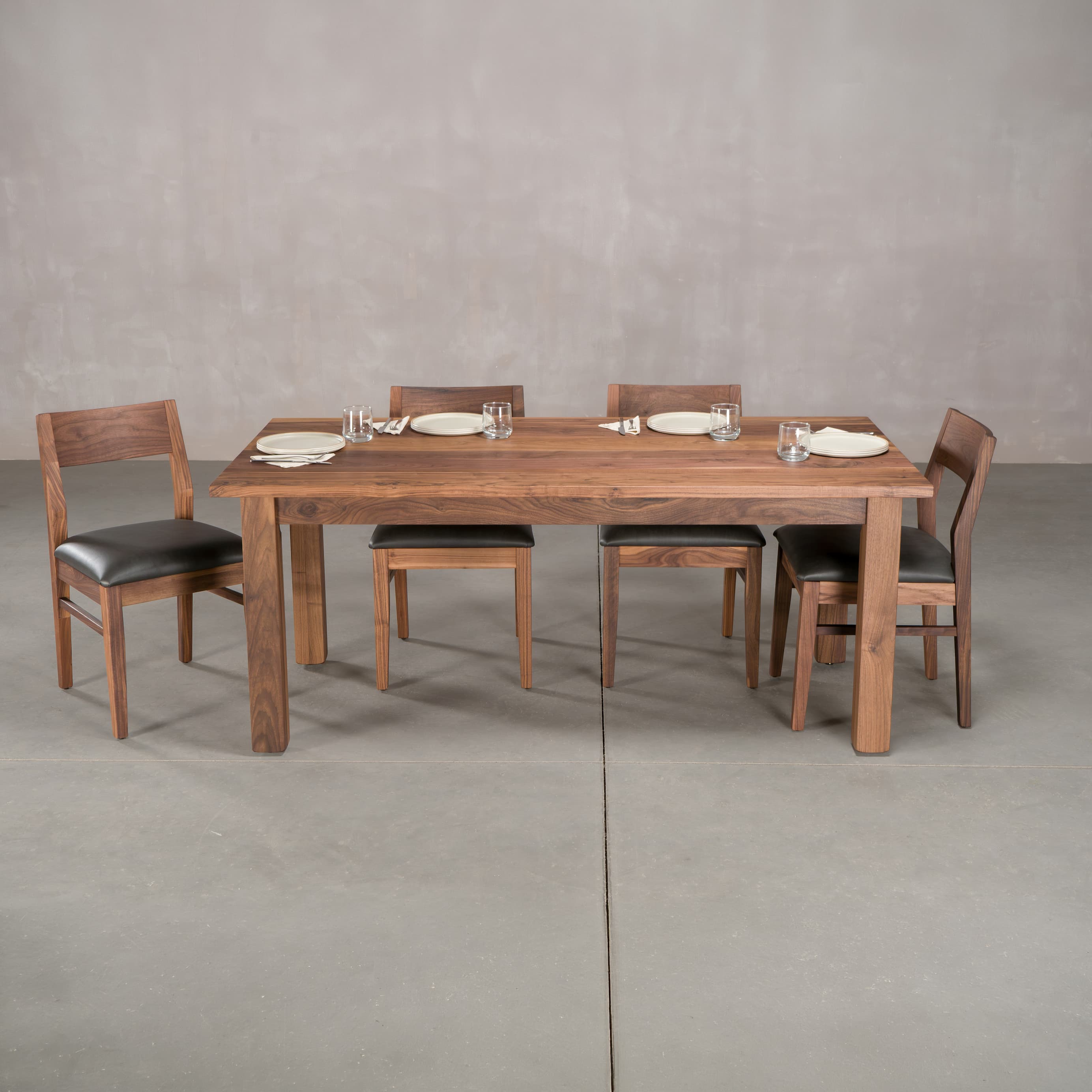 rectangle Walnut table 36” wide x 72” long, finished in Pure D on Parker base; shown with Walnut Aubrey chairs
