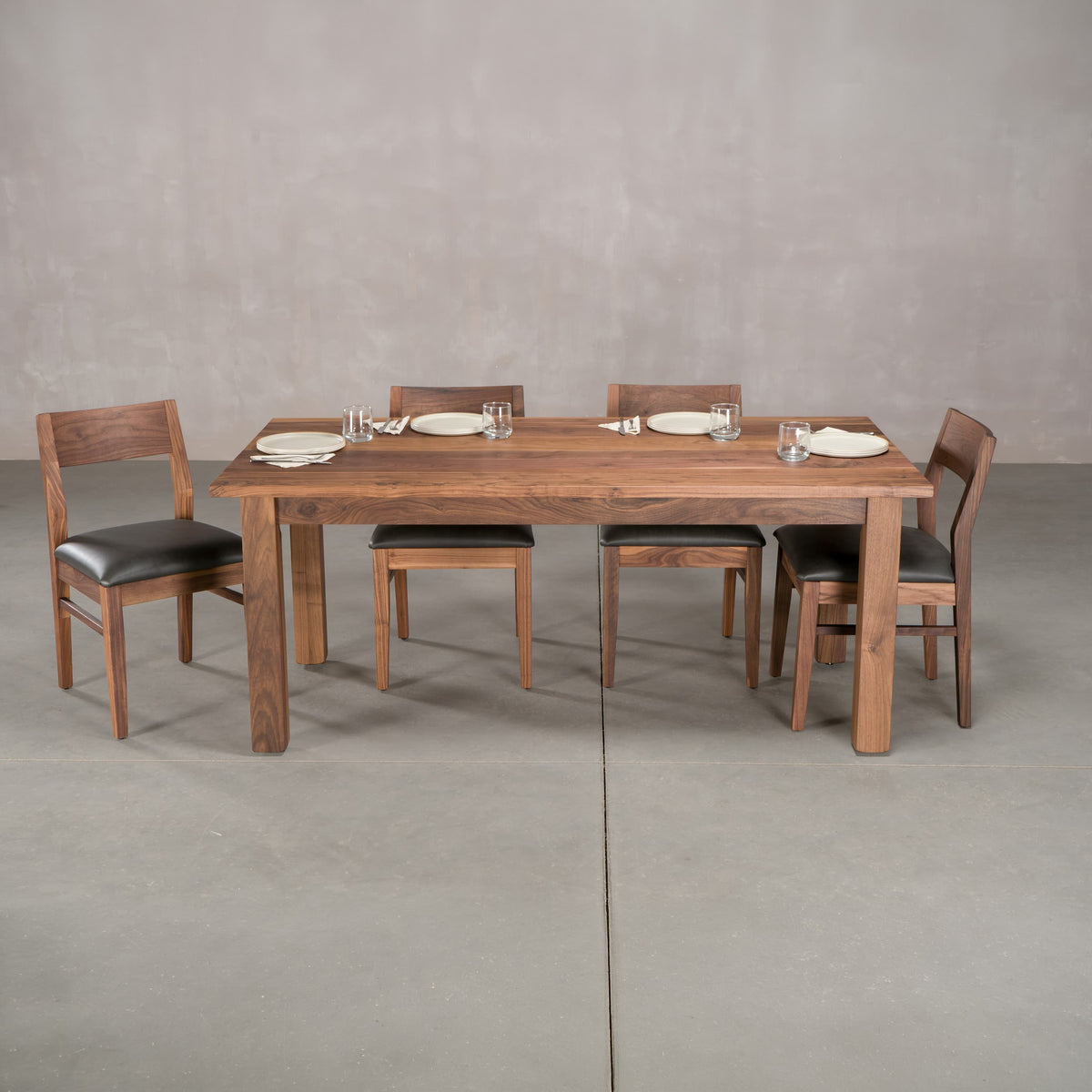 rectangle Walnut table 36” wide x 72” long, finished in Pure D on Parker base; shown with Walnut Aubrey chairs