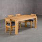 extendable Oak Parsons table 36” wide x 68” long, finished in Pure D on Estling base; shown with Oak Aubrey chairs