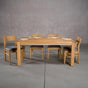extendable Oak Parsons table 36” wide x 68” long, finished in Pure D on Estling base; shown with Aubrey chairs
