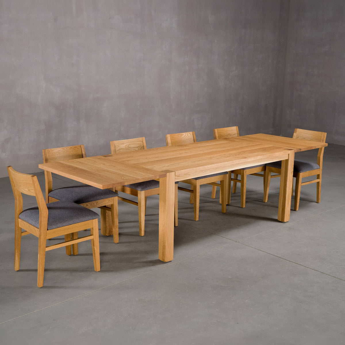 extendable Oak Parsons table 36” wide x 68” long, with 2-18