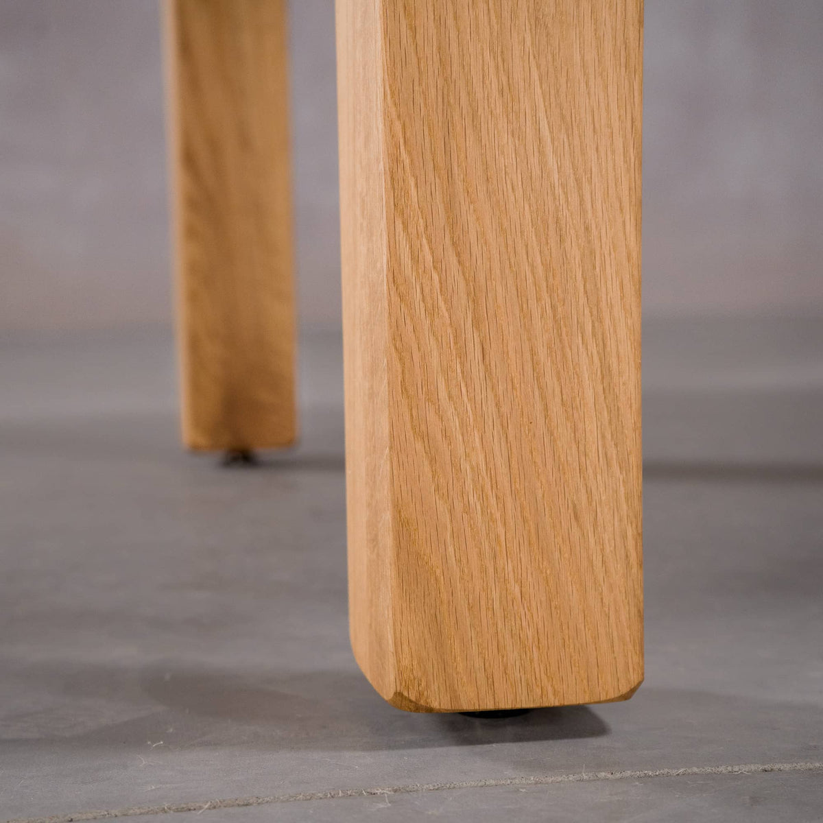post legs of an Estling base in Oak finished in Pure D