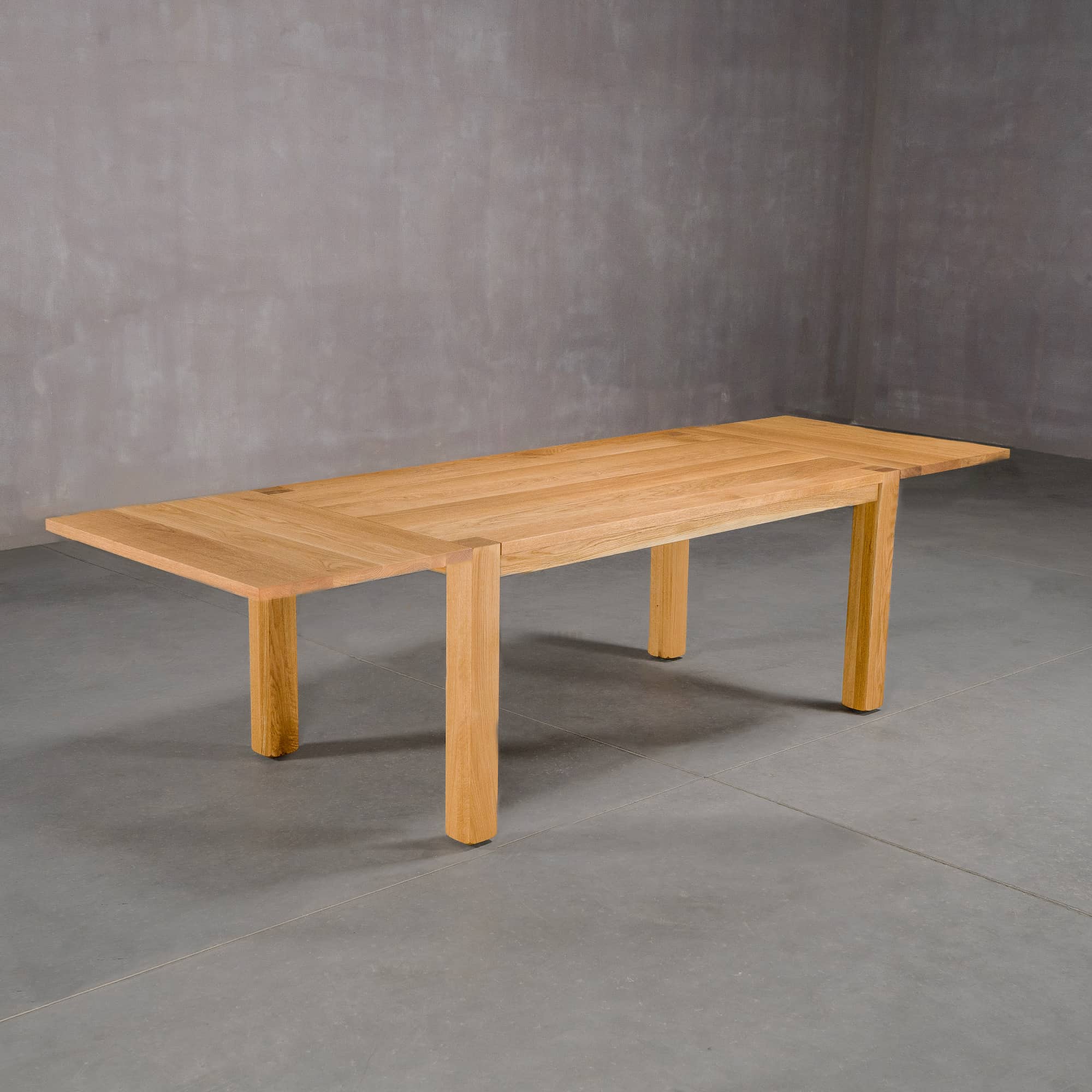 extendable Oak Parsons table 36” wide x 68” long with 2-18