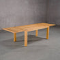 extendable Oak Parsons table 36” wide x 68” long with 2-18