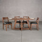 elliptical Walnut table 36” wide x 72” long, finished in Pure D on Moraine base; shown with Walnut Aubrey chairs