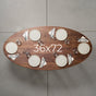 seating at elliptical Walnut table 36” wide x 72” long, finished in Pure D 