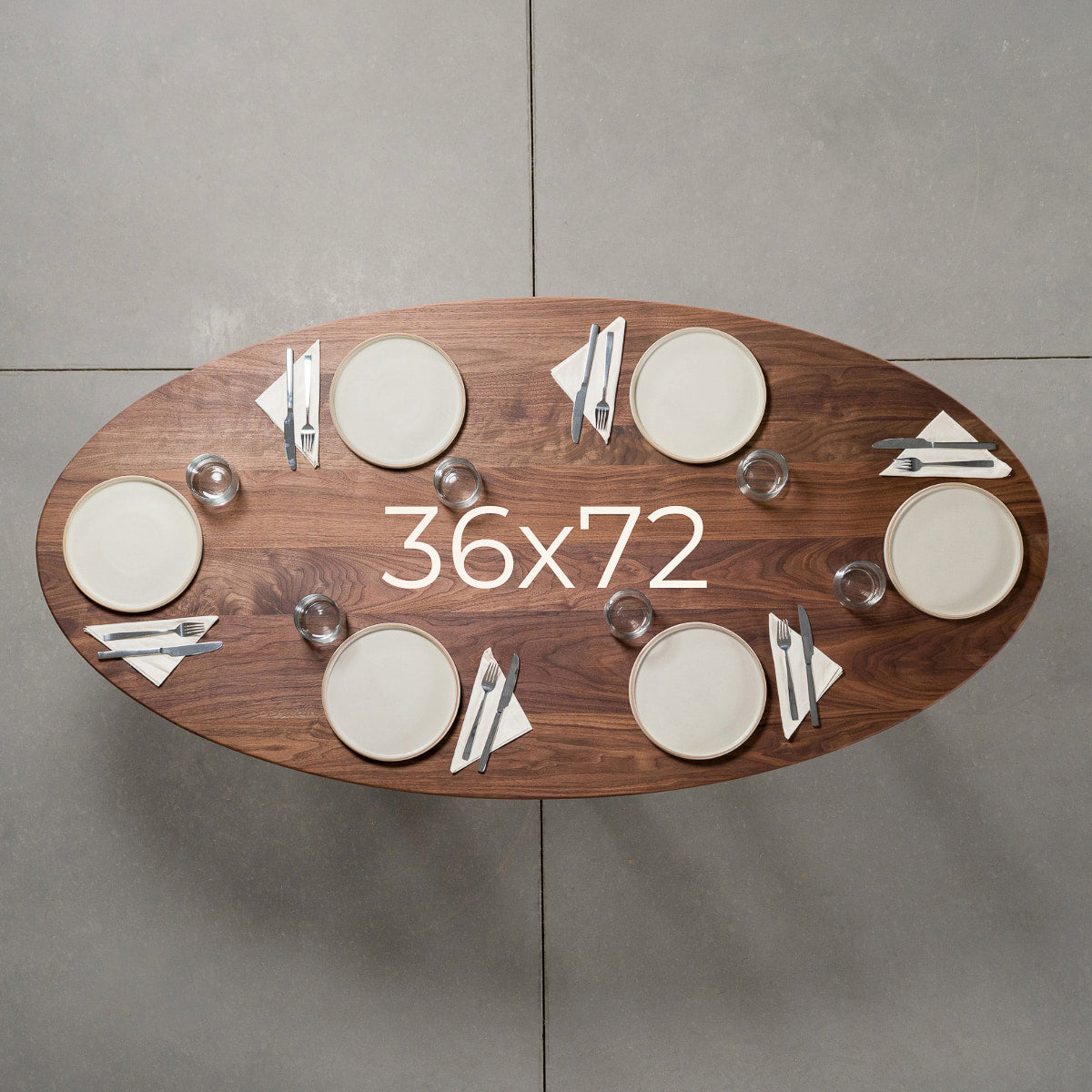 seating at elliptical Walnut table 36” wide x 72” long, finished in Pure D 