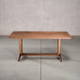 rectangle Walnut table 36” wide x 72” long, finished in Pure D on Tobin trestle base