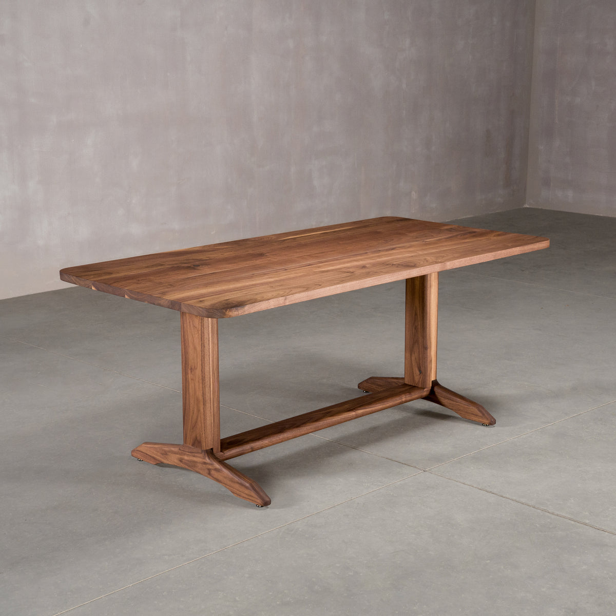 rectangle Walnut table 36” wide x 72” long, finished in Pure D on Tobin trestle base