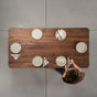 seating at a rectangle Walnut table 36” wide x 72” long, finished in Pure D with rounded corners