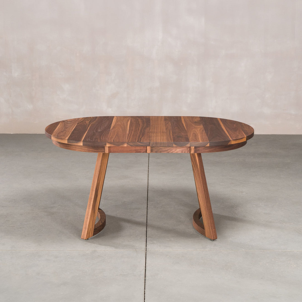 oval extendable Walnut table 36” wide x 60” long, finished in Pure D on Chesbro legs