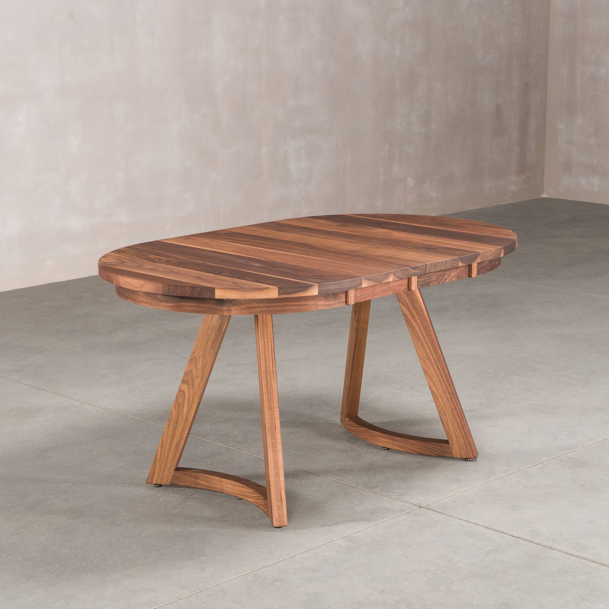 oval extendable Walnut table 36” wide x 60” long finished in Pure D on Chesbro legs