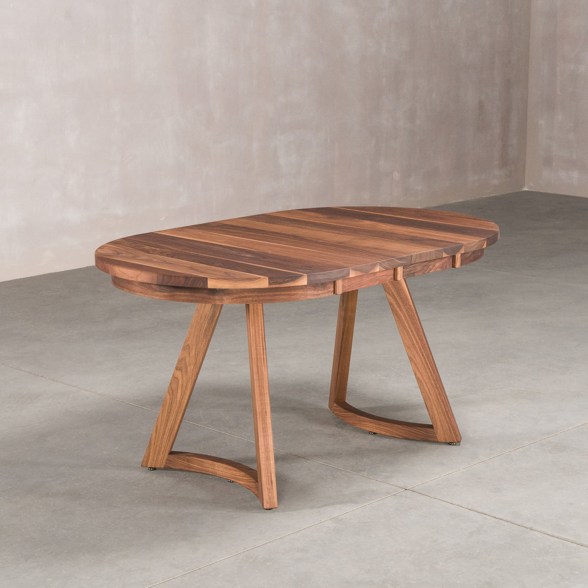 oval extendable Walnut table 36” wide x 60” long finished in Pure D on Chesbro legs