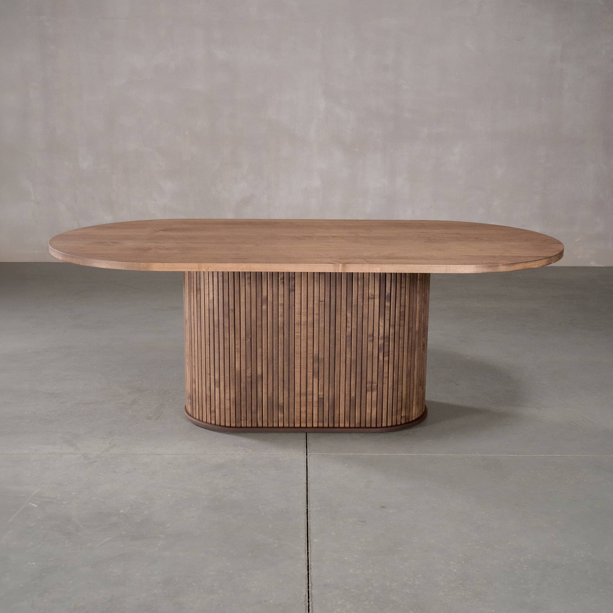 racetrack oval Maple table 42” wide x 84” long, finished in Coconut W on oval Como pedestal base