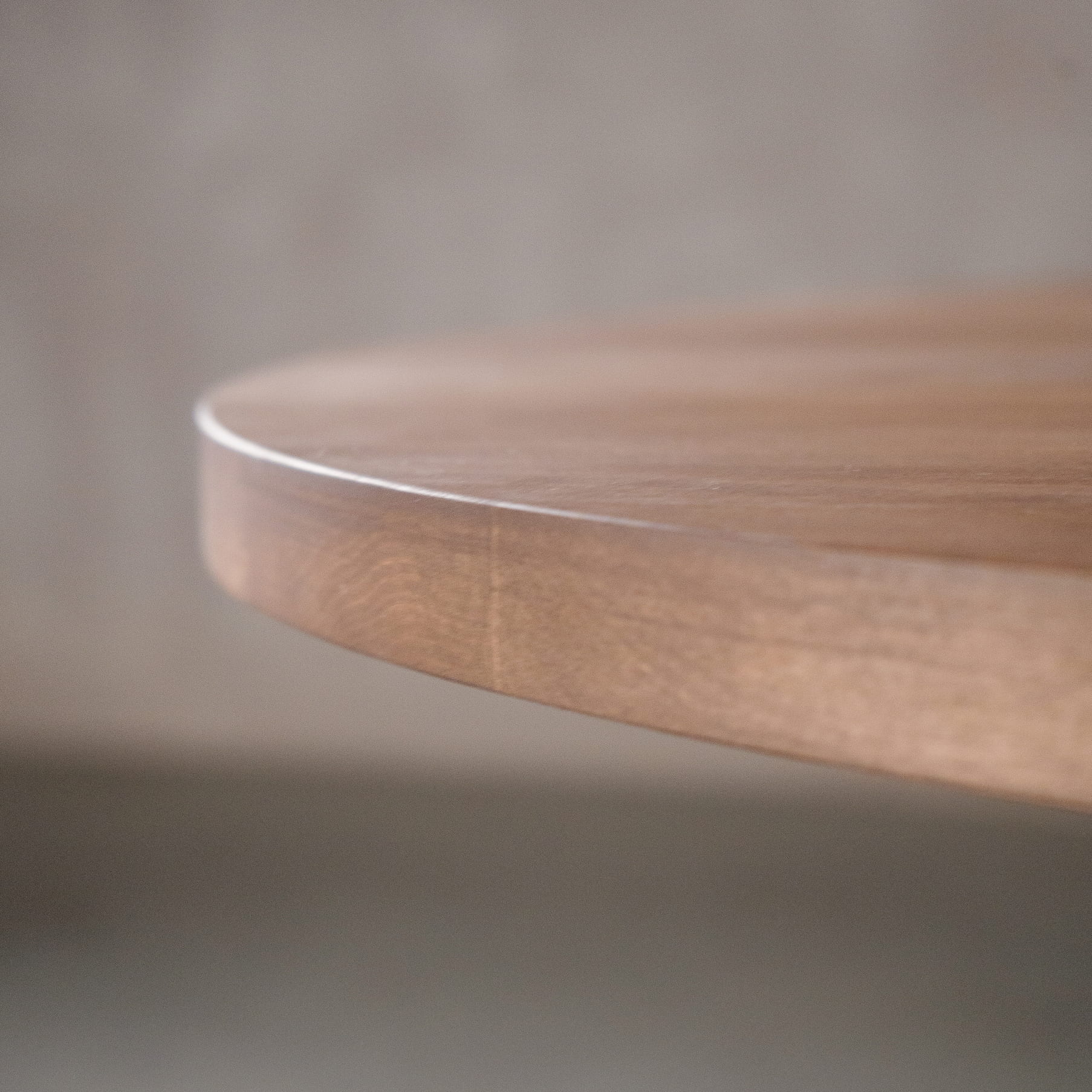 the Seymour edge on a racetrack oval Maple table finished in Coconut W 