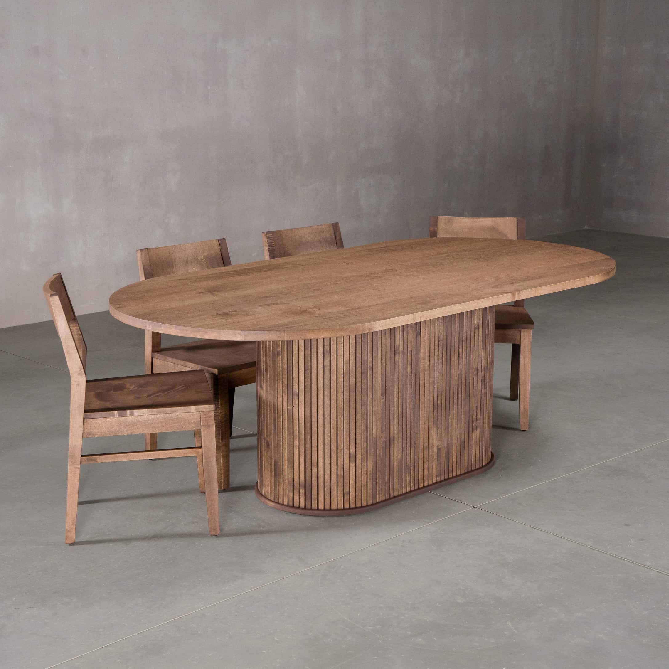 racetrack oval Maple table 42” wide x 84” long, finished in Coconut W on oval Como pedestal base; shown with Aubrey chairs