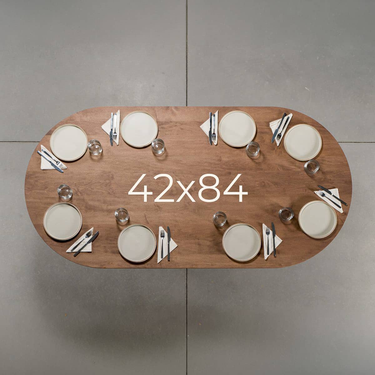 seating at racetrack oval Maple table 42” wide x 84” long, finished in Coconut W 