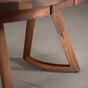 the curve of Chesbro legs on an oval extendable Walnut table finished in Pure D 