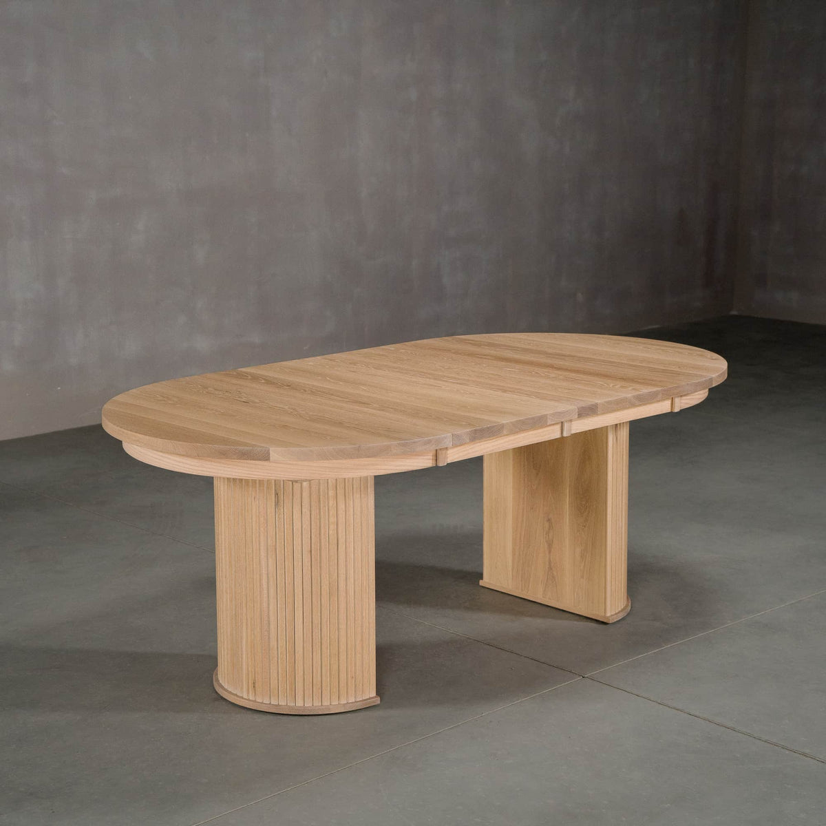 round extendable White Oak table 42” wide x 42” long, with 2-18” leaves finished in Clear D on Split Como base