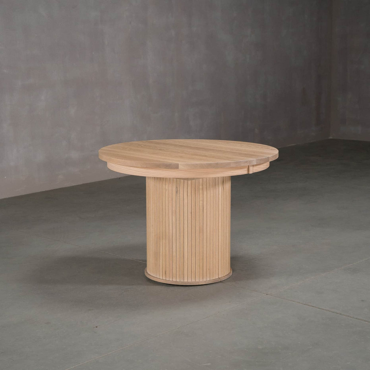 round extendable White Oak table 42” wide x 42” long, finished in Clear D on Split Como base