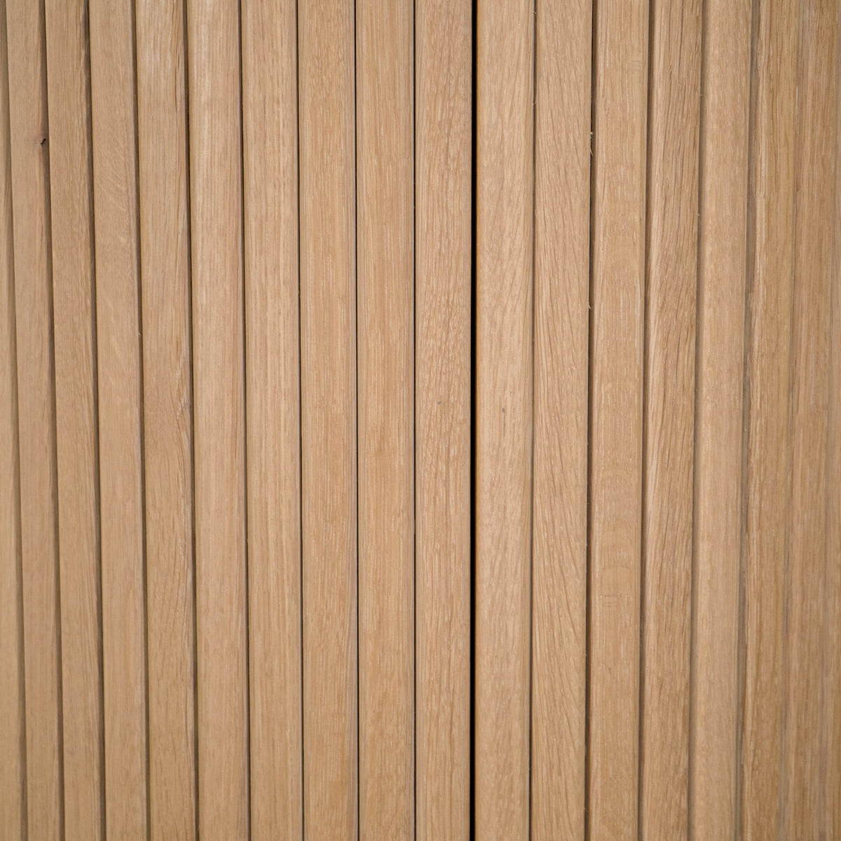 close up detail of fluting on a Split Como base in White Oak finished in Clear D