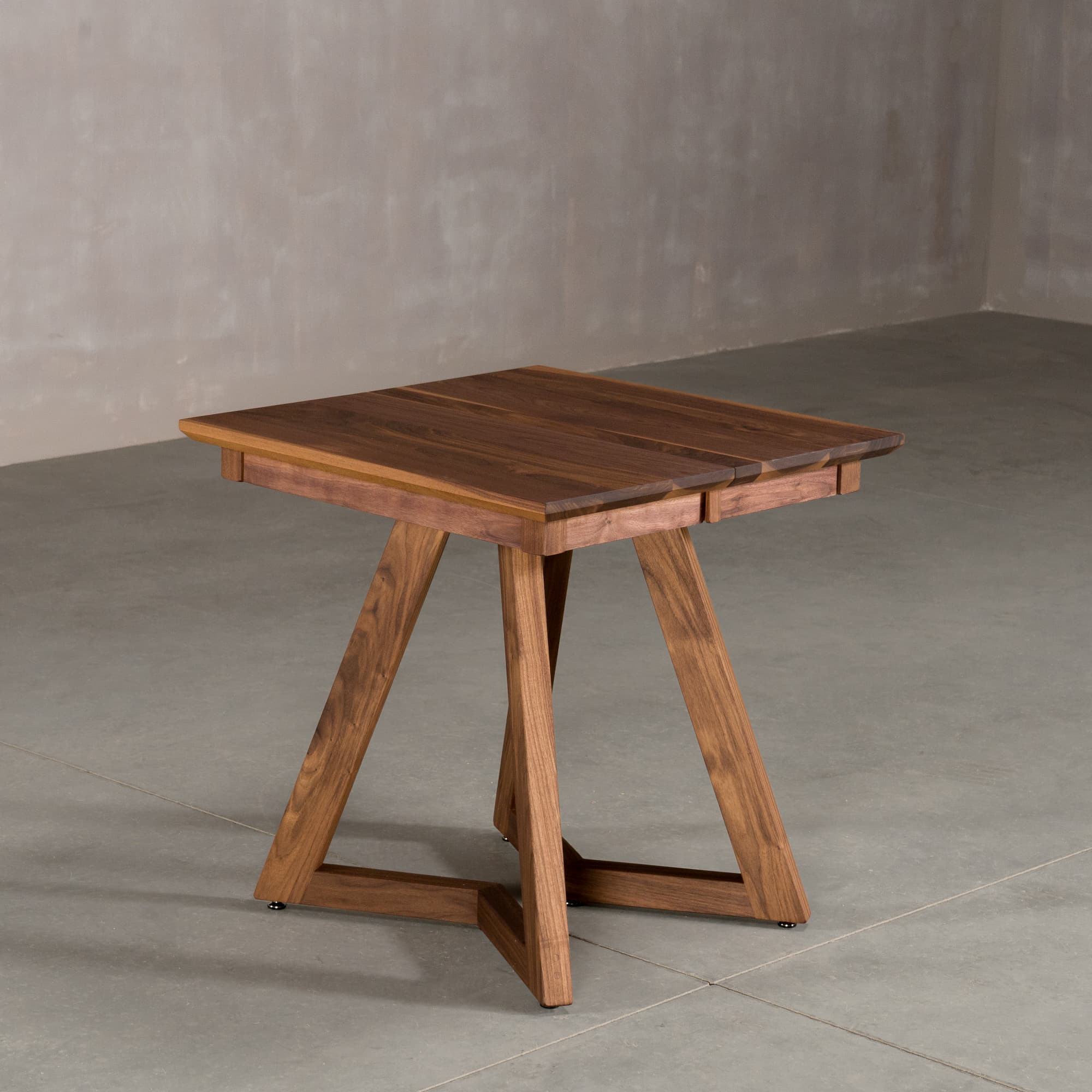square extendable Walnut table 30” wide x 30” long, finished in Pure D on Caldwell legs