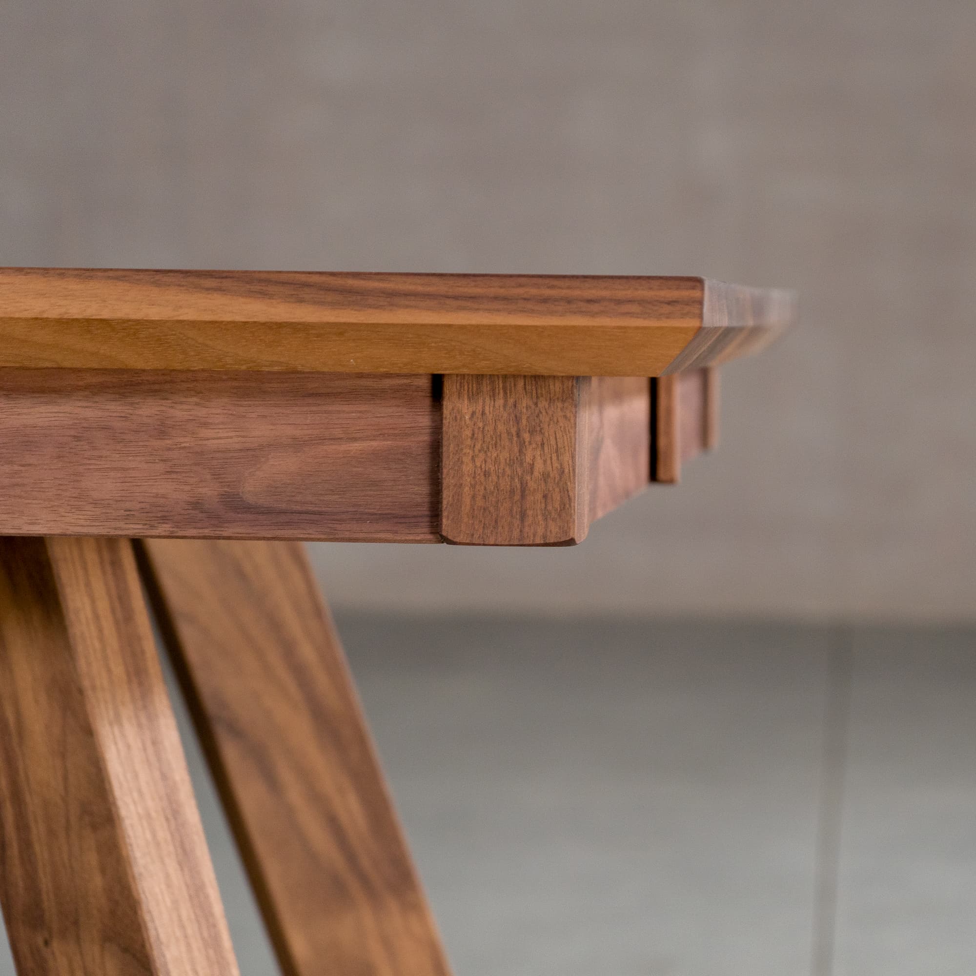 the Finlay edge on a square extendable Walnut table 30” wide x 30” long, finished in Pure D on Caldwell legs 
