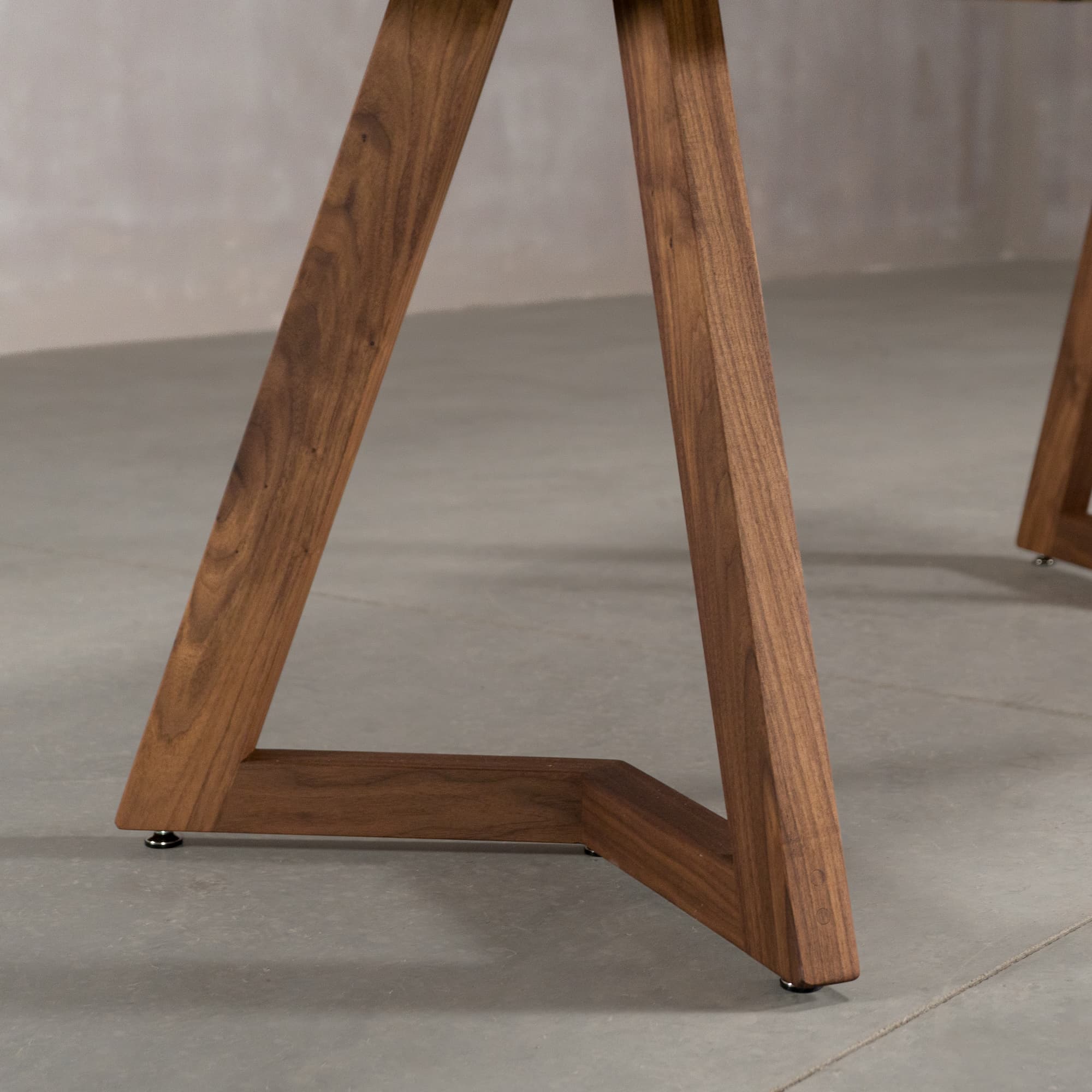 the angle of the Caldwell legs on a square extendable Walnut table finished in Pure D on Caldwell legs 