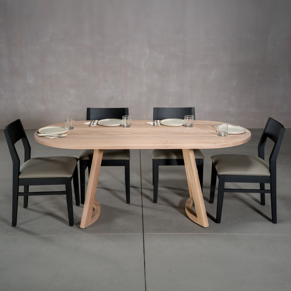 oval White Oak table 36” wide x 72” long, finished in Clear D on Chesbro legs shown with Aubrey chairs