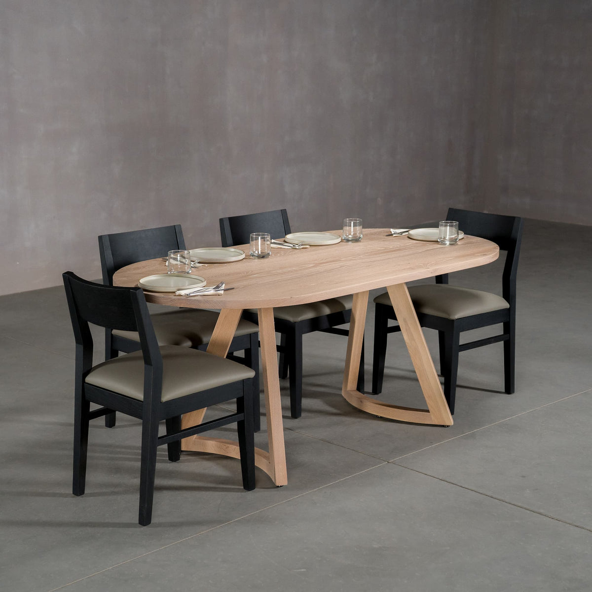 oval White Oak table 36” wide x 72” long, finished in Clear D on Chesbro legs shown with Aubrey chairs