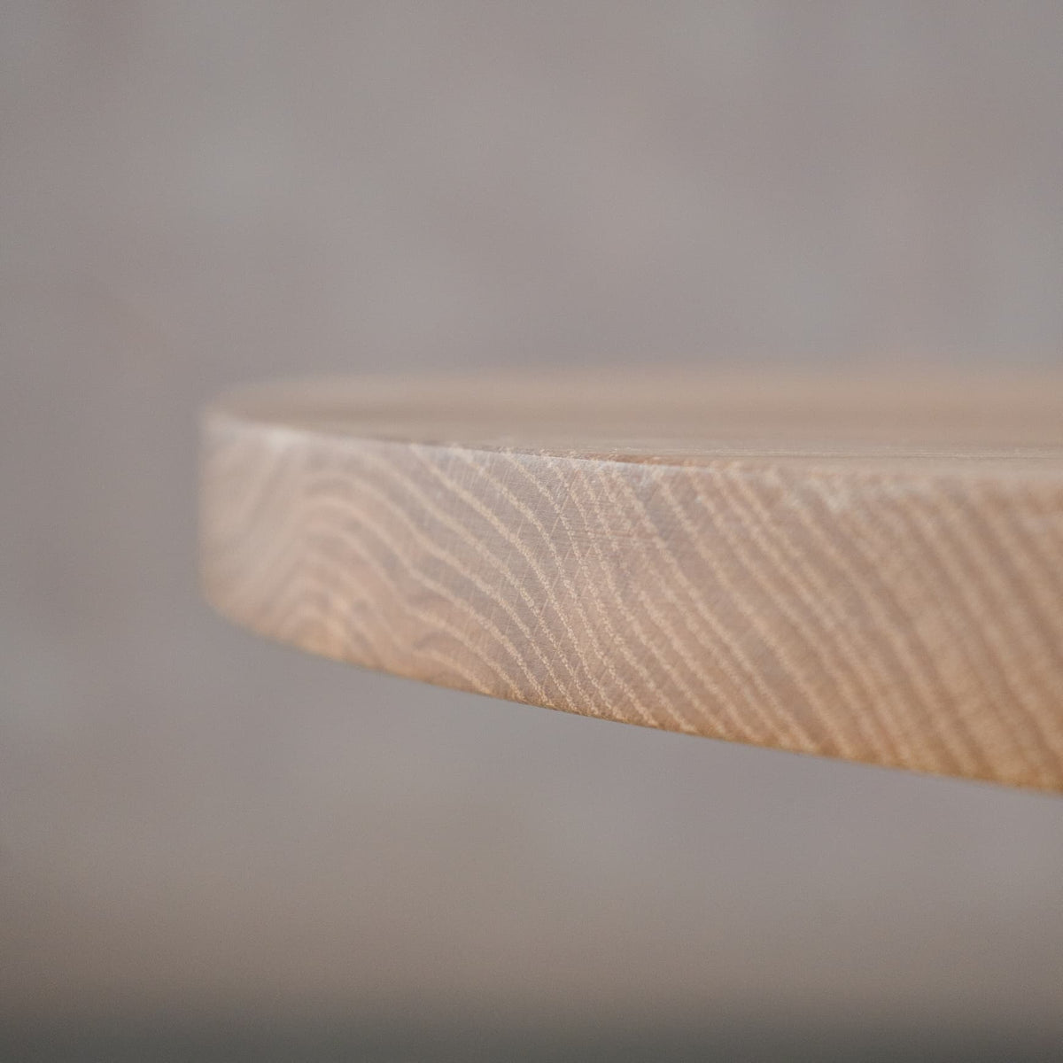 close up of the Seymour edge on an oval White Oak table finished in Clear D 
