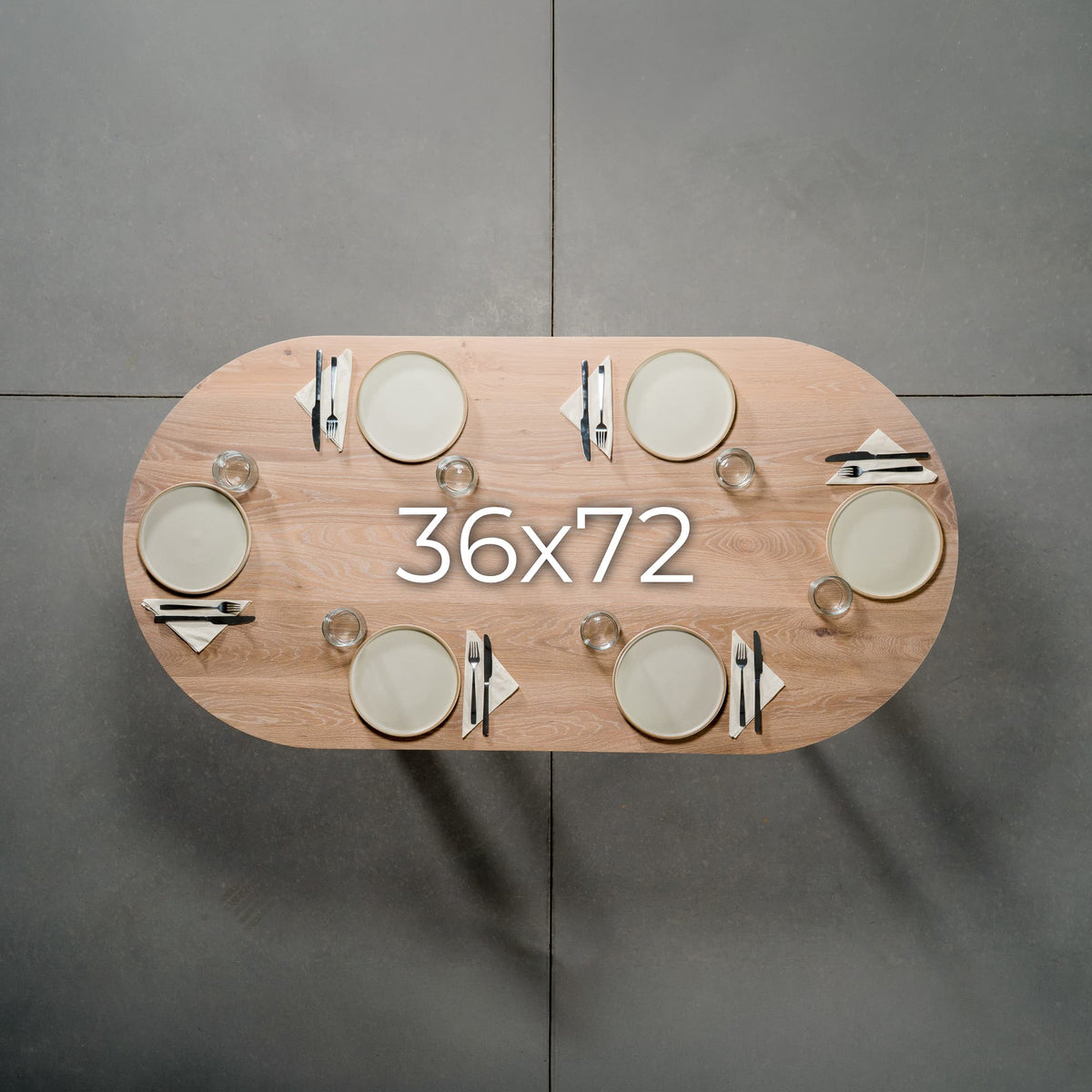 overhead view of an oval White Oak table 36” wide x 72” long, finished in Clear D set for 6 people