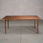 rectangular Walnut table 42” wide x 72” long, finished in Pure D on Milford base
