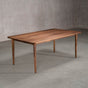 rectangular Walnut table 42” wide x 72” long, finished in Pure D on Milford base
