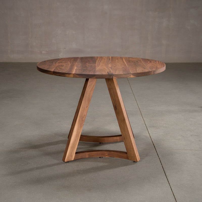 round  Walnut table 42” wide x 42” long, finished in Pure D on Chesbro legs