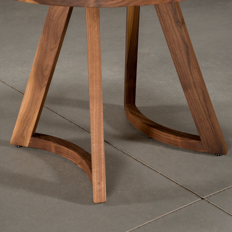close up of Chesbro legs on a round  Walnut table 42” wide x 42” long, finished in Pure D 